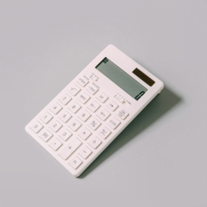 White calculator with a blank display on a light grey background.